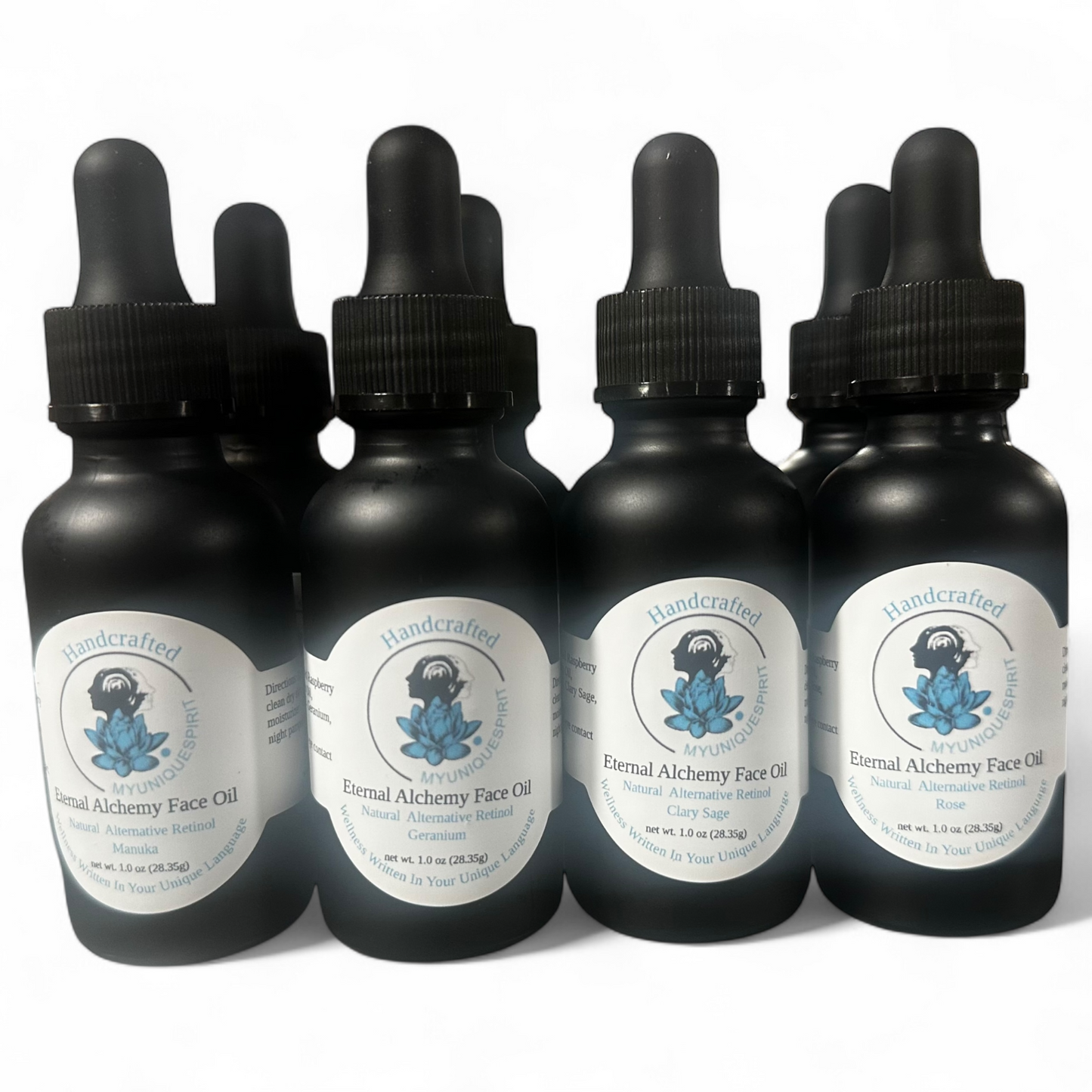 Eight bottles of External Alchemy Face Oil, arranged against a white background. Each bottle has a white label with blue and black text.