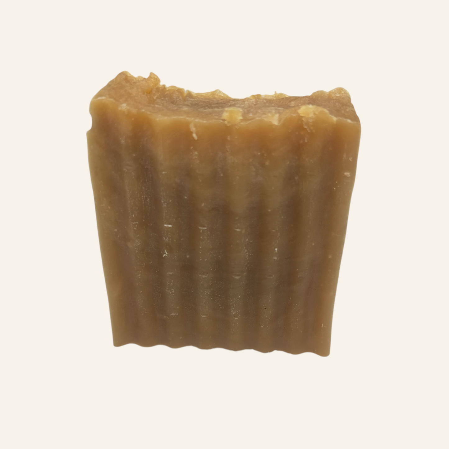 Bar of brown soap on a white background
