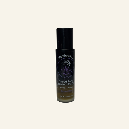 Bottle of 'Sacred Roots Revival Hair Oil' on a white background