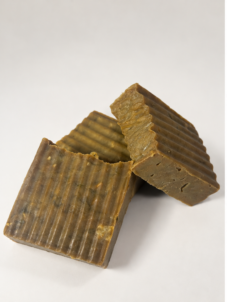 Black Rose by the Sea handcrafted soap bars by MyUniqueSpirit, featuring natural brown tones, botanical flecks, and textured ridges on a soft cream background.