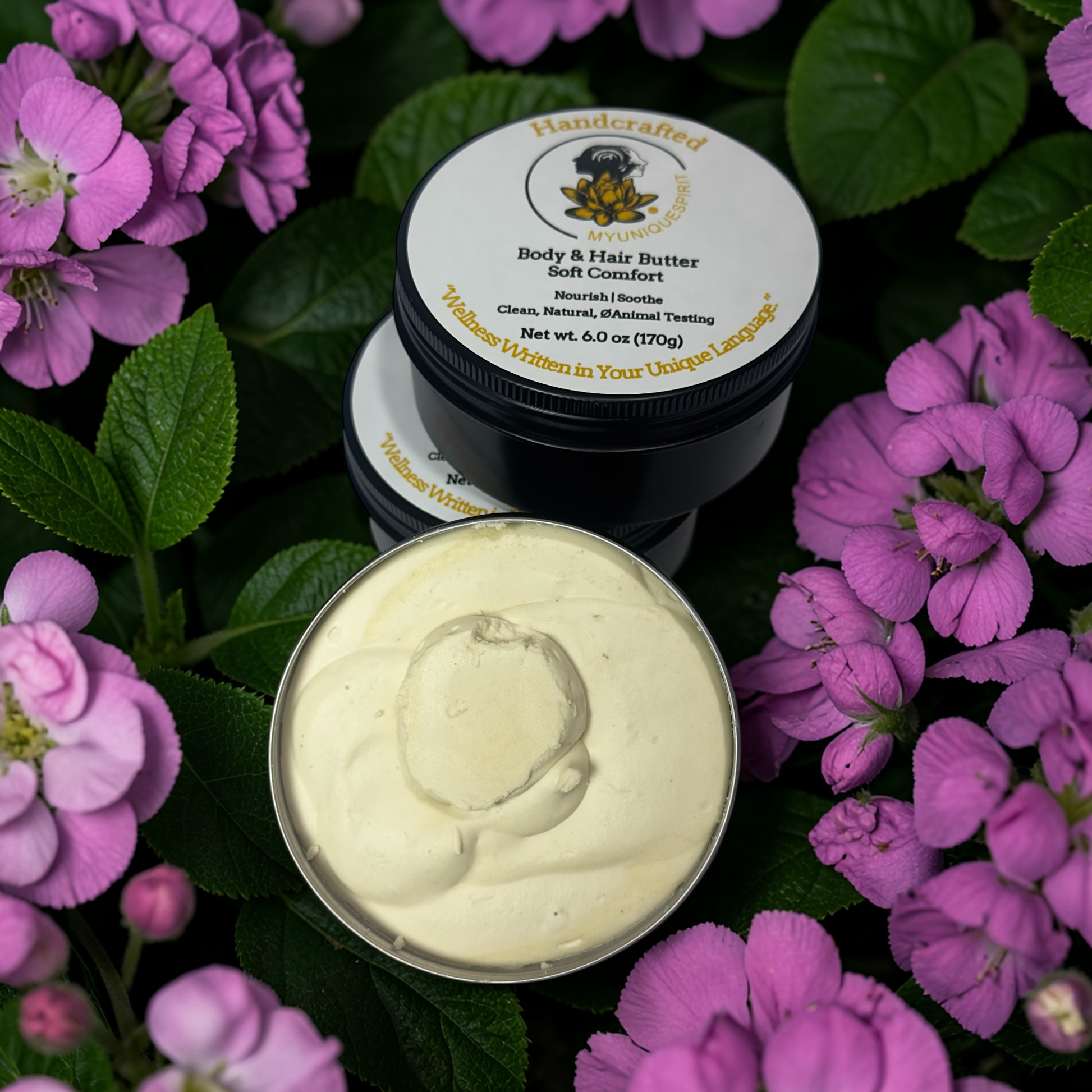 Handcrafted body and hair butter jar with a lid on purple flowers